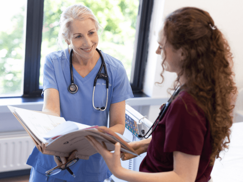 Two doctors reviewing file 